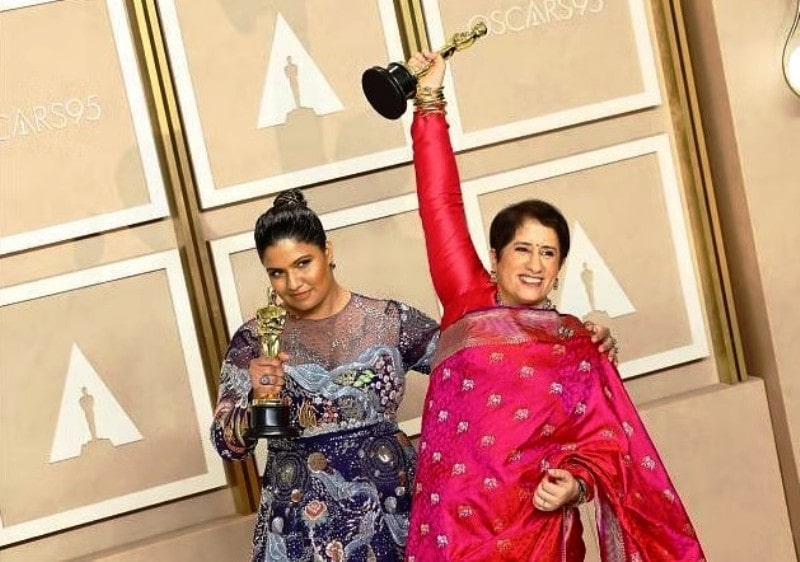 Kartiki Gonsalves (left) with Guneet holding the Oscar