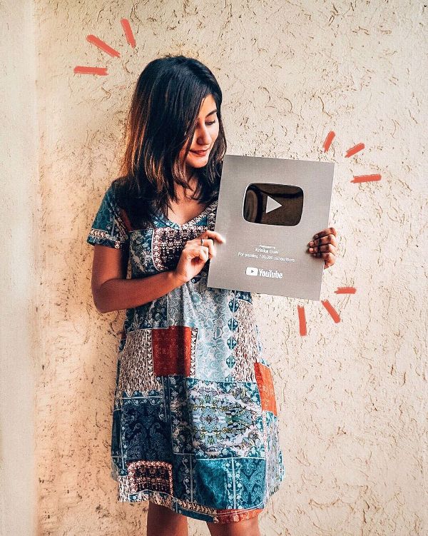 Kritika Goel with YouTube's Silver Play Button after 100,000 subscribers