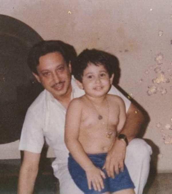 A photo of Pradyot sitting on his father's lap