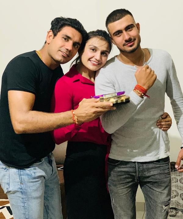 Saweety Boora with her brothers, Naveen boora (extreme left) and Mandeep Boora
