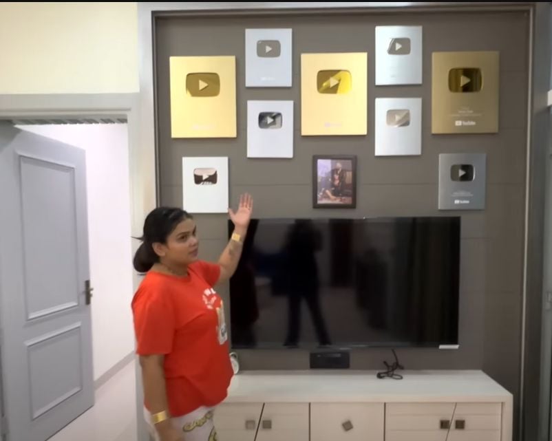 The wall of YouTube accolades at the Malik's house