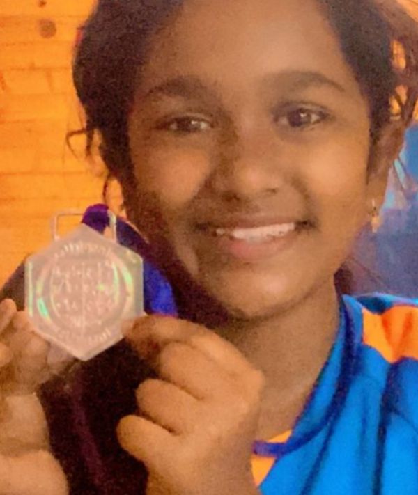 Vanshika Kaushik posing with her medal, which she won at the InspirUs event in school