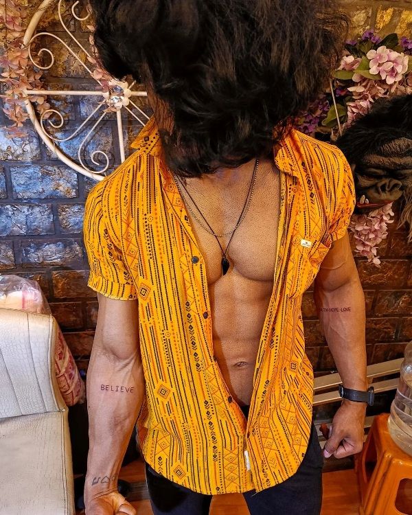 Vishnu Joshi's tattoos on his inner arms