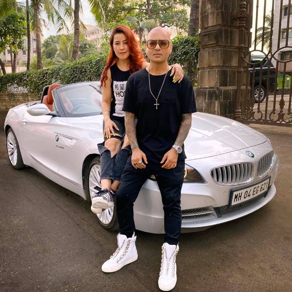 Aalim Hakim and his wife, Shano Hanspal, with his 2019 BMW Z4 car