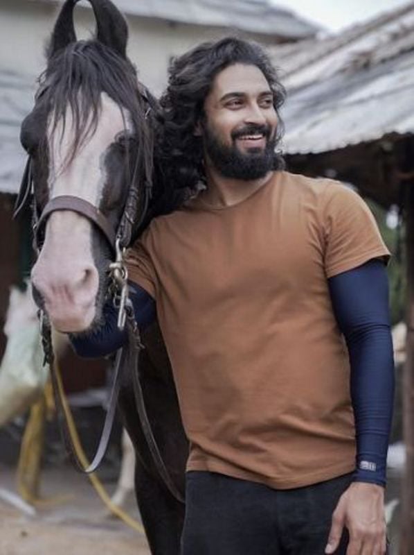 Dev Mohan with a horse