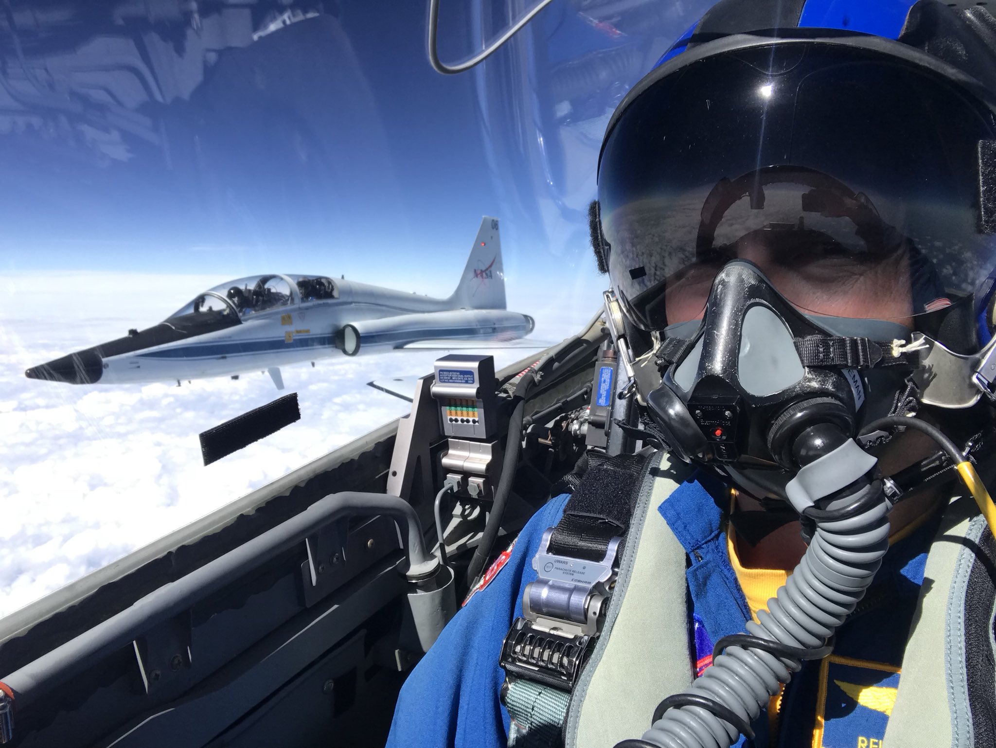Gregory R. Wiseman clicking a selfie while flying a fighter jet