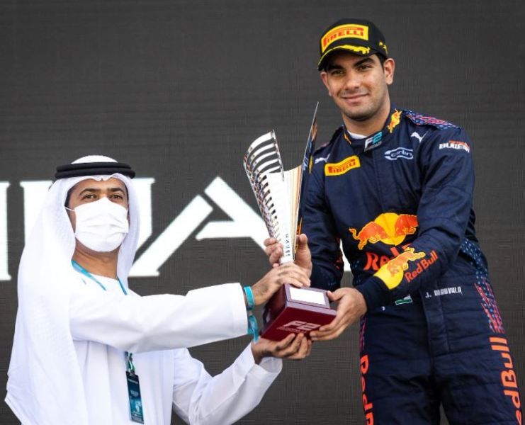 Jehan receiving trophy after securing 3rd position in the feature race in FIA Formula 2 championship in 2021