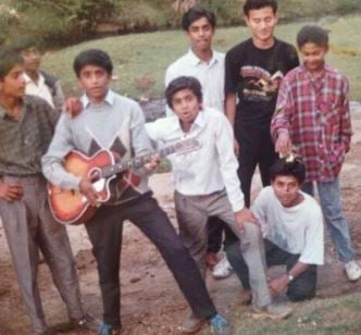 M. Sasikumar in his school days (holding the guitar)