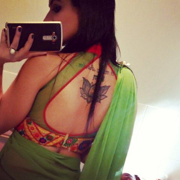 Priya Malik's tattoo inked on her back