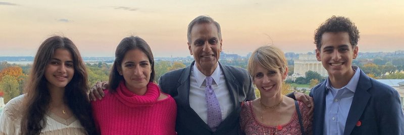 Richard R. Verma with his wife and children