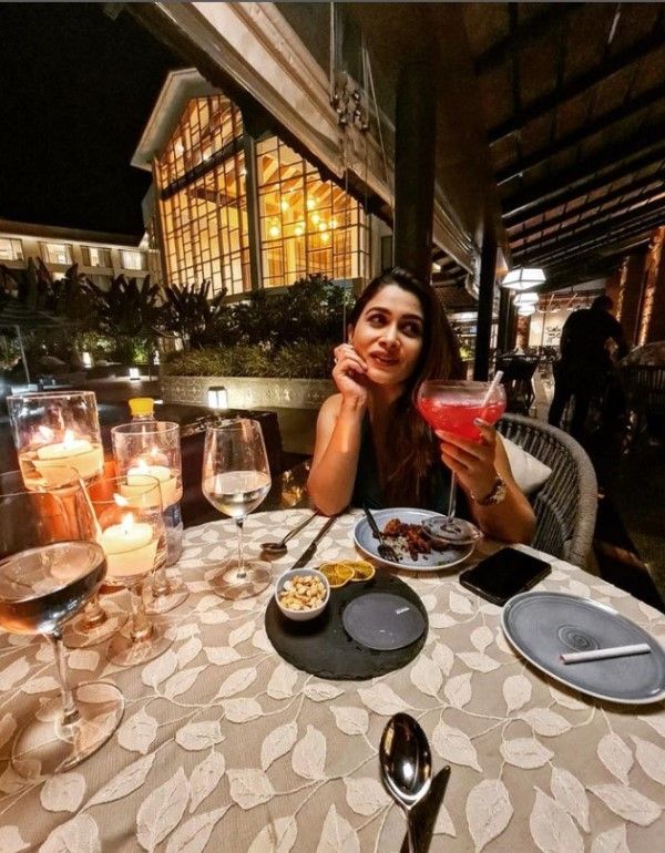 A photo shared by Ruchita Jadhav on Instagram in which she was seen spotted posing with an alcoholic beverage