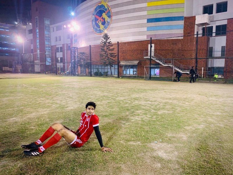 A photo of Arjun Chakrabarty resting after playing football