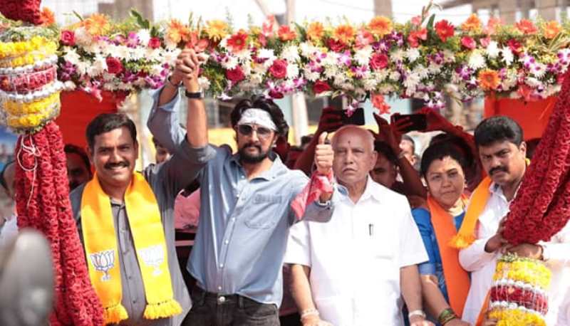 A photograph of B. Y. Vijayendra with brother (extreme right) and his father during his election campaign