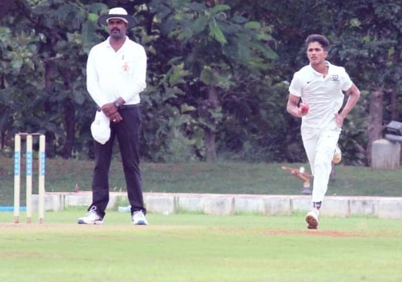 A photograph of Nitish Kumar Reddy bowling in a match