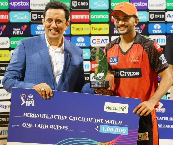 A photograph of Nitish Kumar Reddy receiving the best catch award and cash prize