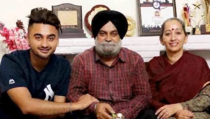 A picture of Shubh's parents and his brother