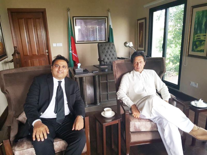Fawad Chaudhry (left) with Imran Khan