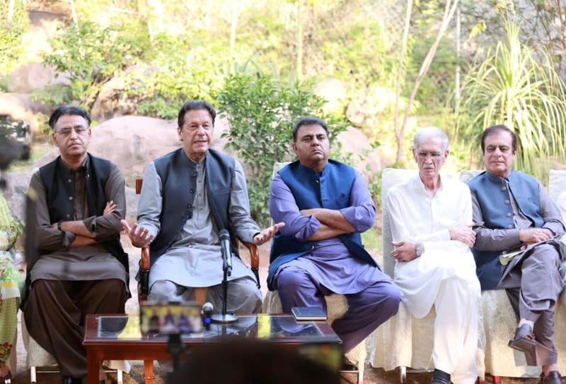 Fawad Chaudhry (third from left) during a press conference