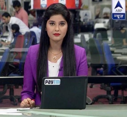 Kanchan Dogra Negi as a news anchor at ABP News