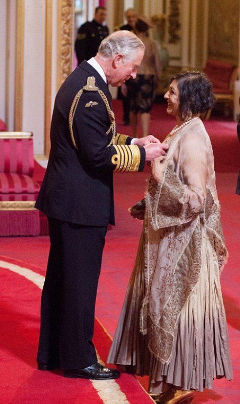Meera Syal receiving CBE from Prince Charles