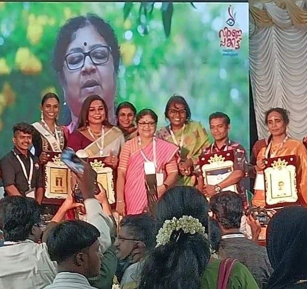 Praveen and a few transgender activists being felicitated by the state minister R. Bindhu