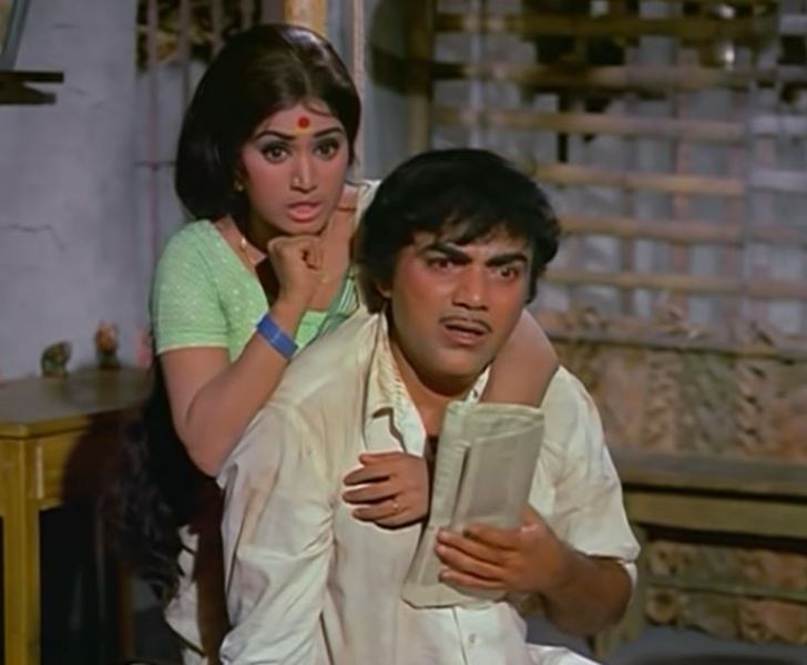 Rama Prabha (as Rukmini) and Mehmood (as Pavitra Kumar Rai 'Puttan') in a still from the film 'Do Phool' (1973)