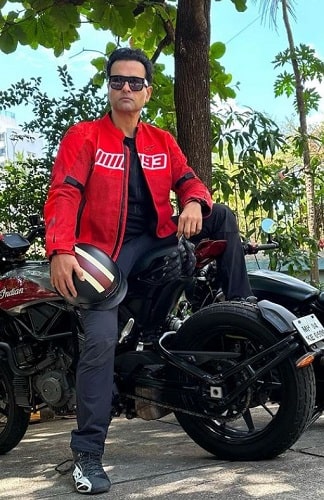 Rohit Roy sitting on his motorcycle