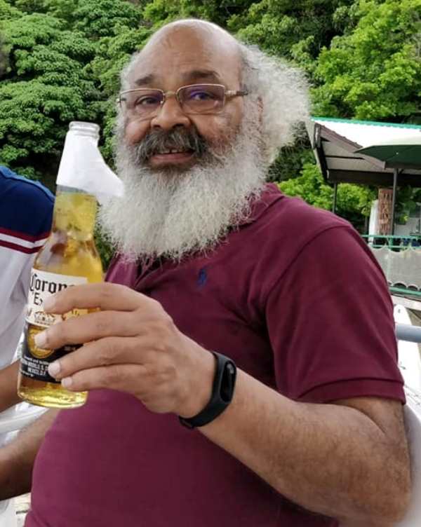 Surya Mohan Kulshreshtha drinking beer