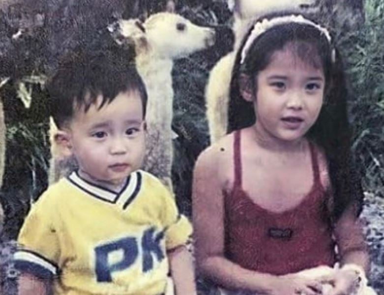 A childhood image of IU with her brother