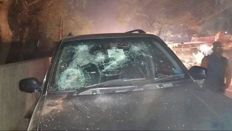 A photo of a car damaged between the fight of the followers of Vikas Singh and Abhay Singh