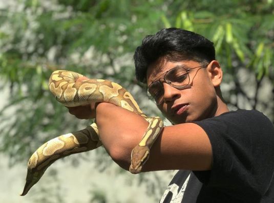 Abhirup Kadam and his ball python
