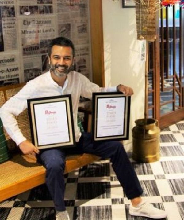 Ashesh Sajnani with his Best Regional Indian and Best Cafe awards
