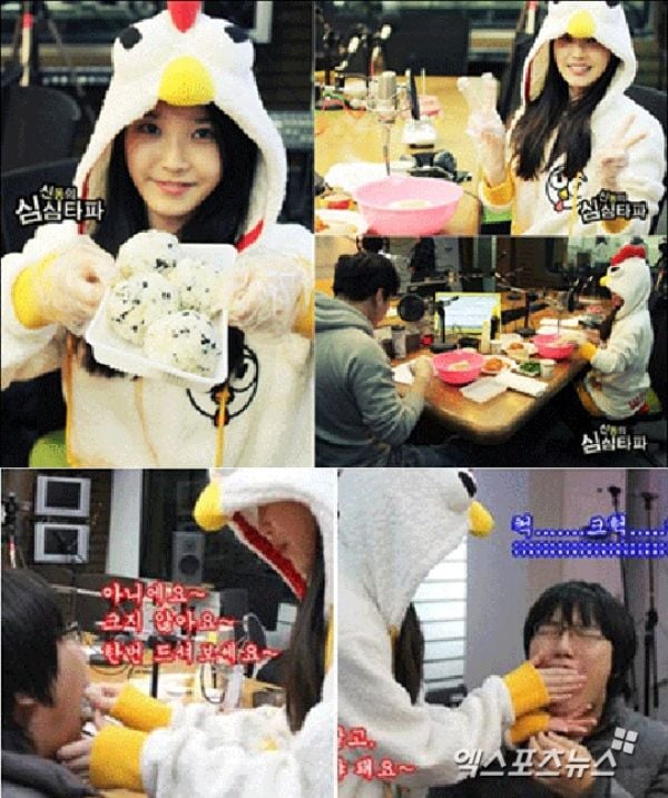 IU hand-feeding rice balls to a male fan of hers