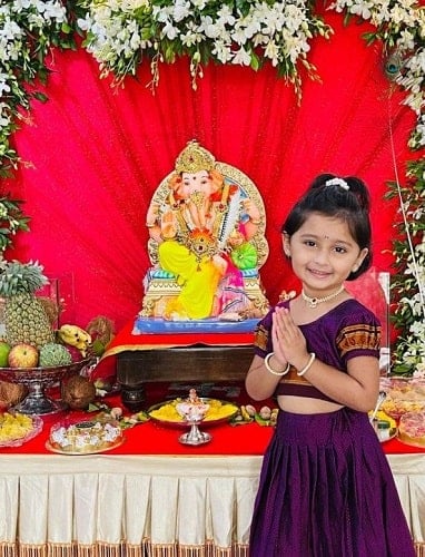 Myra Vaikul with an idol of Lord Ganesha