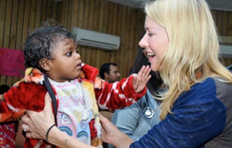 Naomi Watts with the children of HIV patients