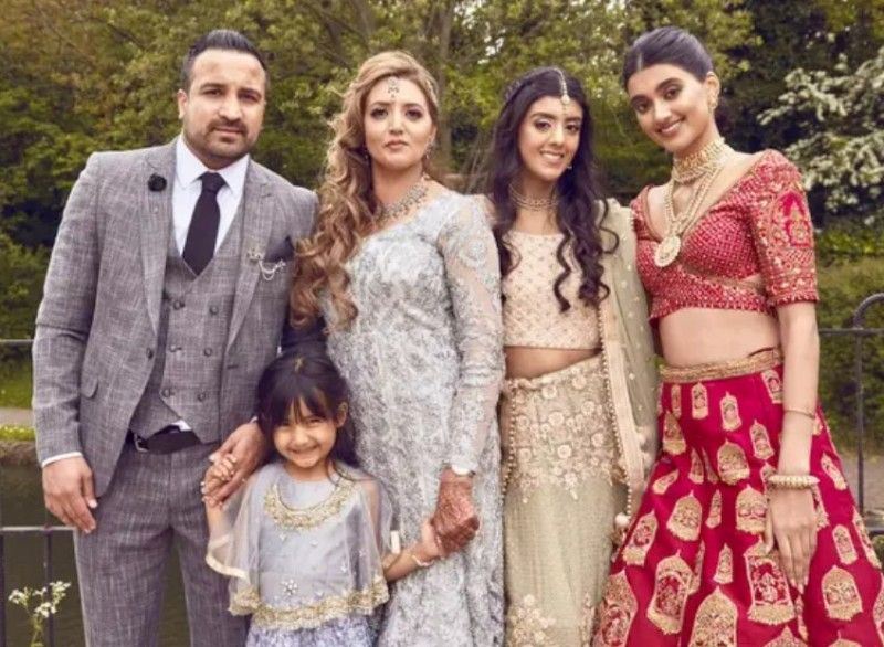 Neelam Gill (extreme right) with her stepfather (extreme left), mother (second from left), younger sister Jasmine (second from right), and the youngest sister Millan