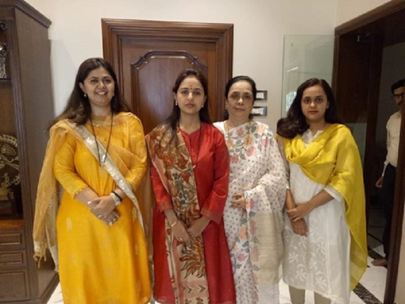 Pankaja Munde (left) with her mother (third from left)