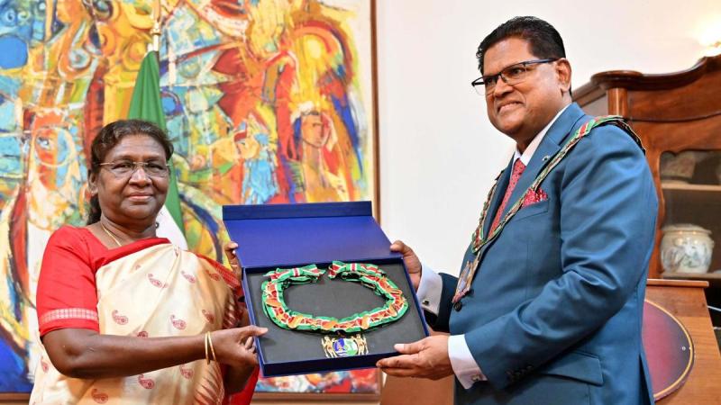 President Droupadi Murmu receiving the Suriname’s highest distinction, “Grand Order of the Chain of the Yellow Star,” from Surinamese President Chandrikapersad Santokhi
