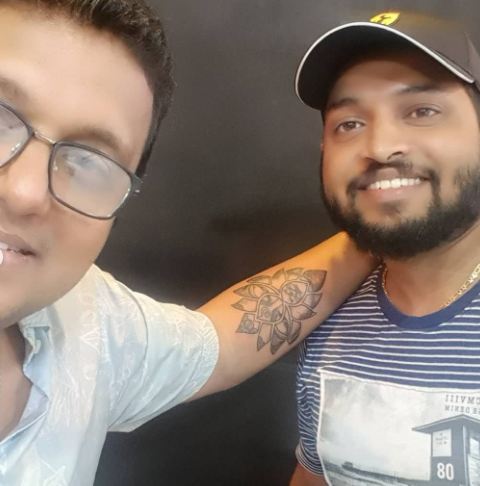 Rajesh Nair with his tattoo artist after getting inked