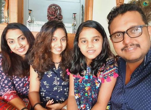 Rajesh Nair with his wife and daughters