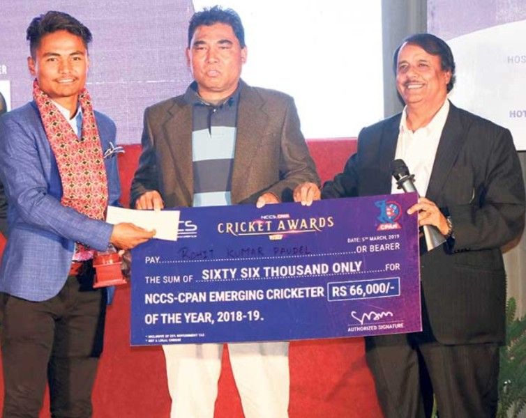Rohit Paudel (left) receiving the Emerging Cricketer of the Year at the NCCS-CPAN Cricket Awards in 2019