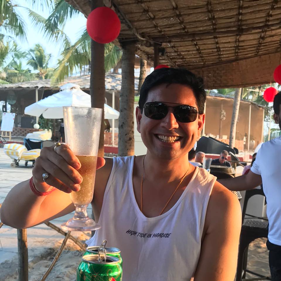 Sandeep Baswana holding a beer glass