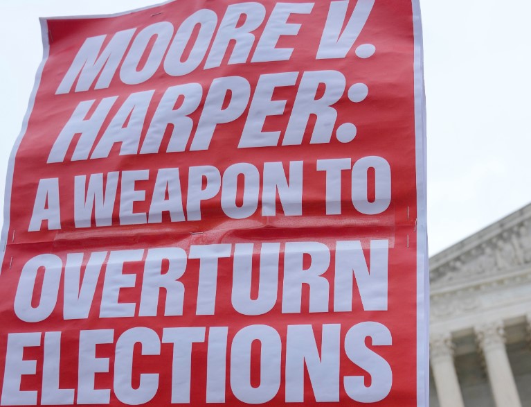 A Moore vs Harper banner unfurled during the case