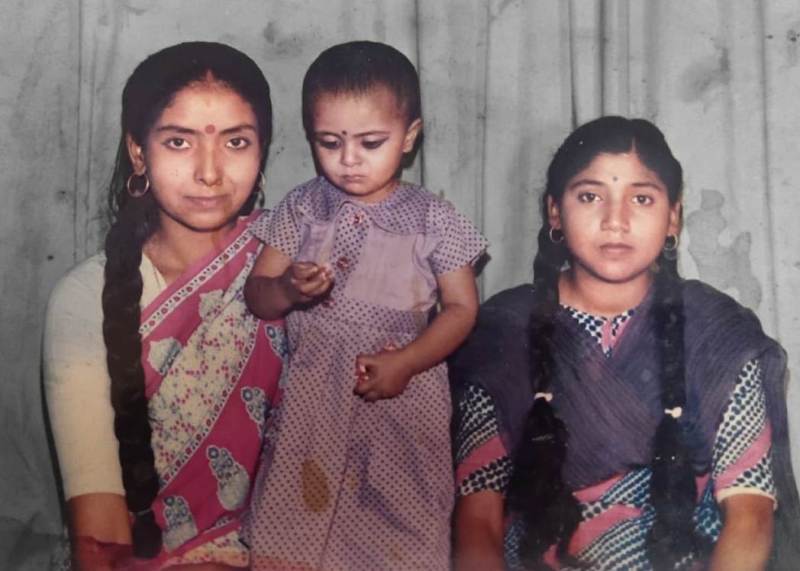 A childhood photo of Ranu Sahu with her mother (left) and aunt