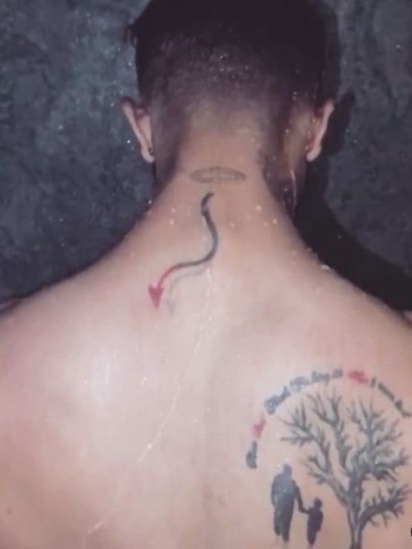 Bhawish Madaan's tattoo on the back side of his neck and right shoulder