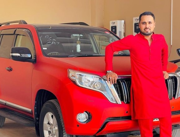 Faheem Ashraf posing with his Toyota Land Cruiser