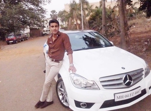 Gautam Rode with his Mercedes car