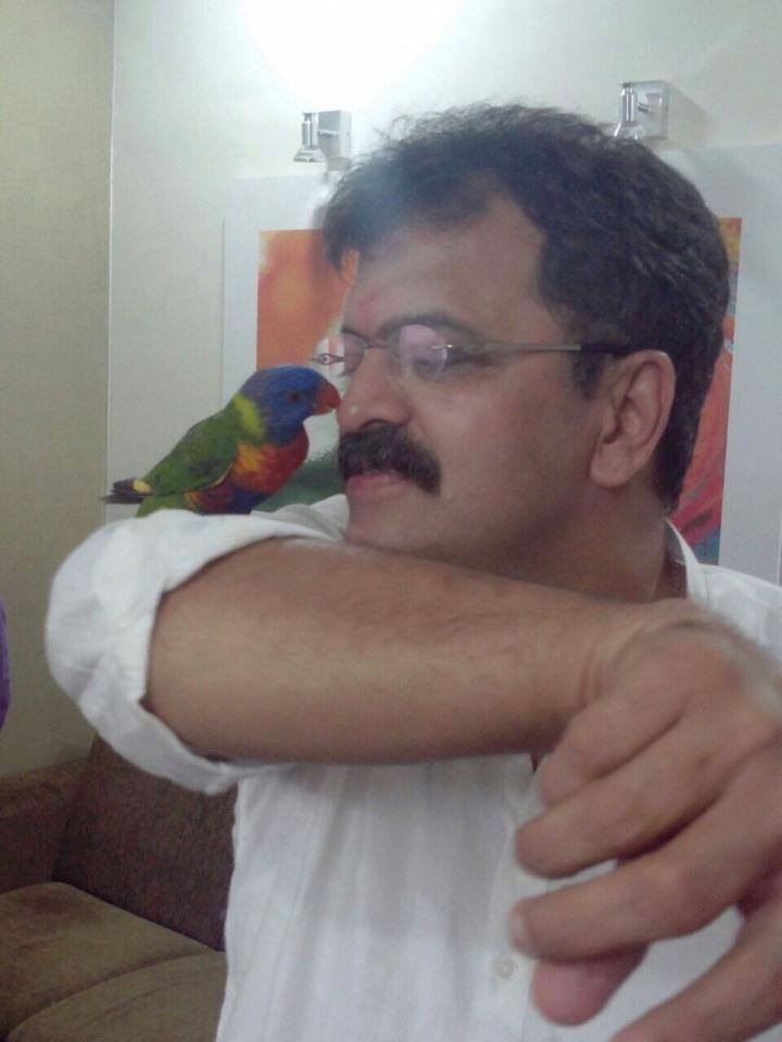 Jitendra Awhad playing with a bird