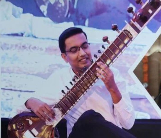 Lokesh M while playing sitar