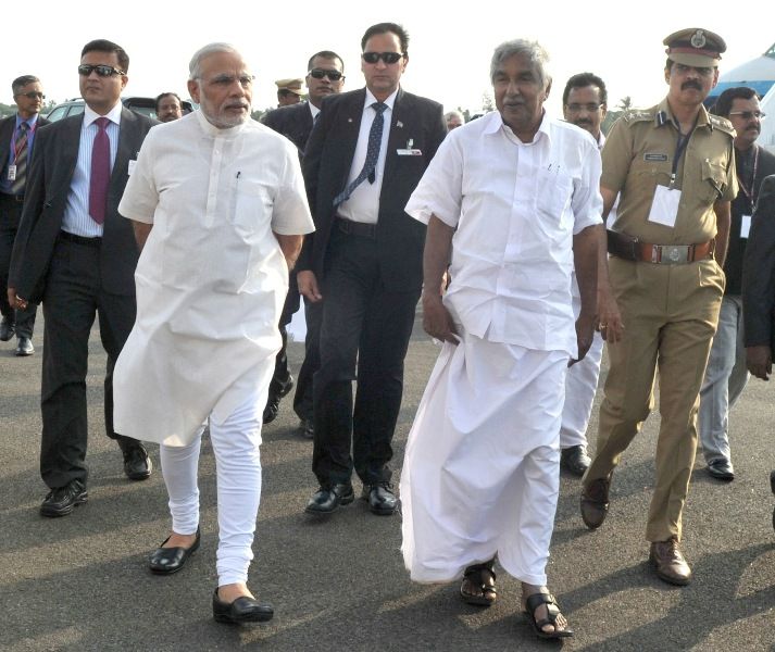 Oommen Chandy, along with Prime Minister Narendra Modi, during their visit to Kochi, Kerala